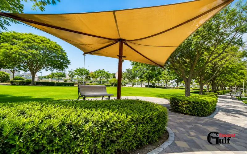 Shaded area sitting bench in Qusais Pond Park