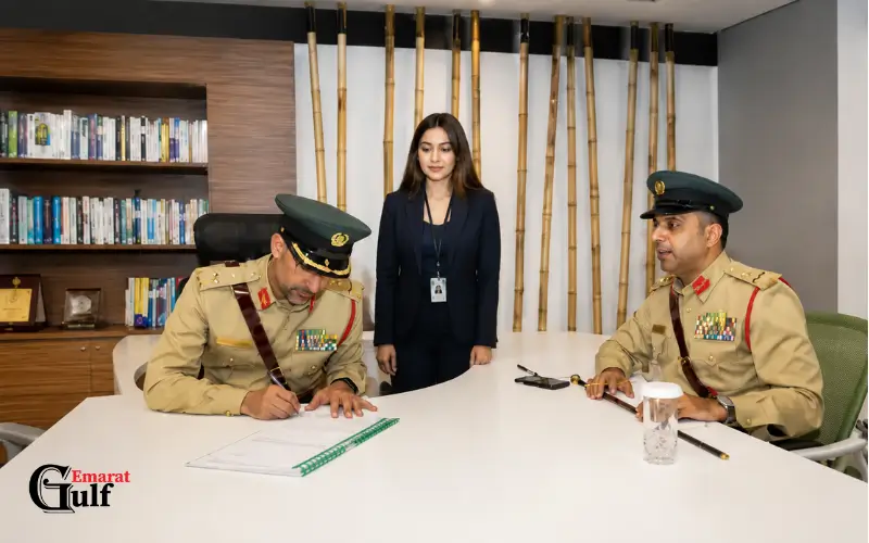 Jebel Ali Police Station officers reviewing documents during reporting crimes and incidents procedures in Duba